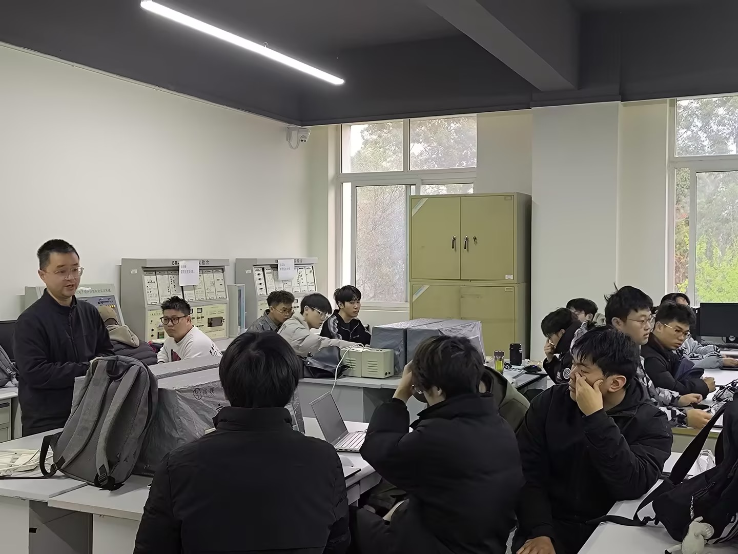 University professor and industry representative shaking hands at collaboration ceremony