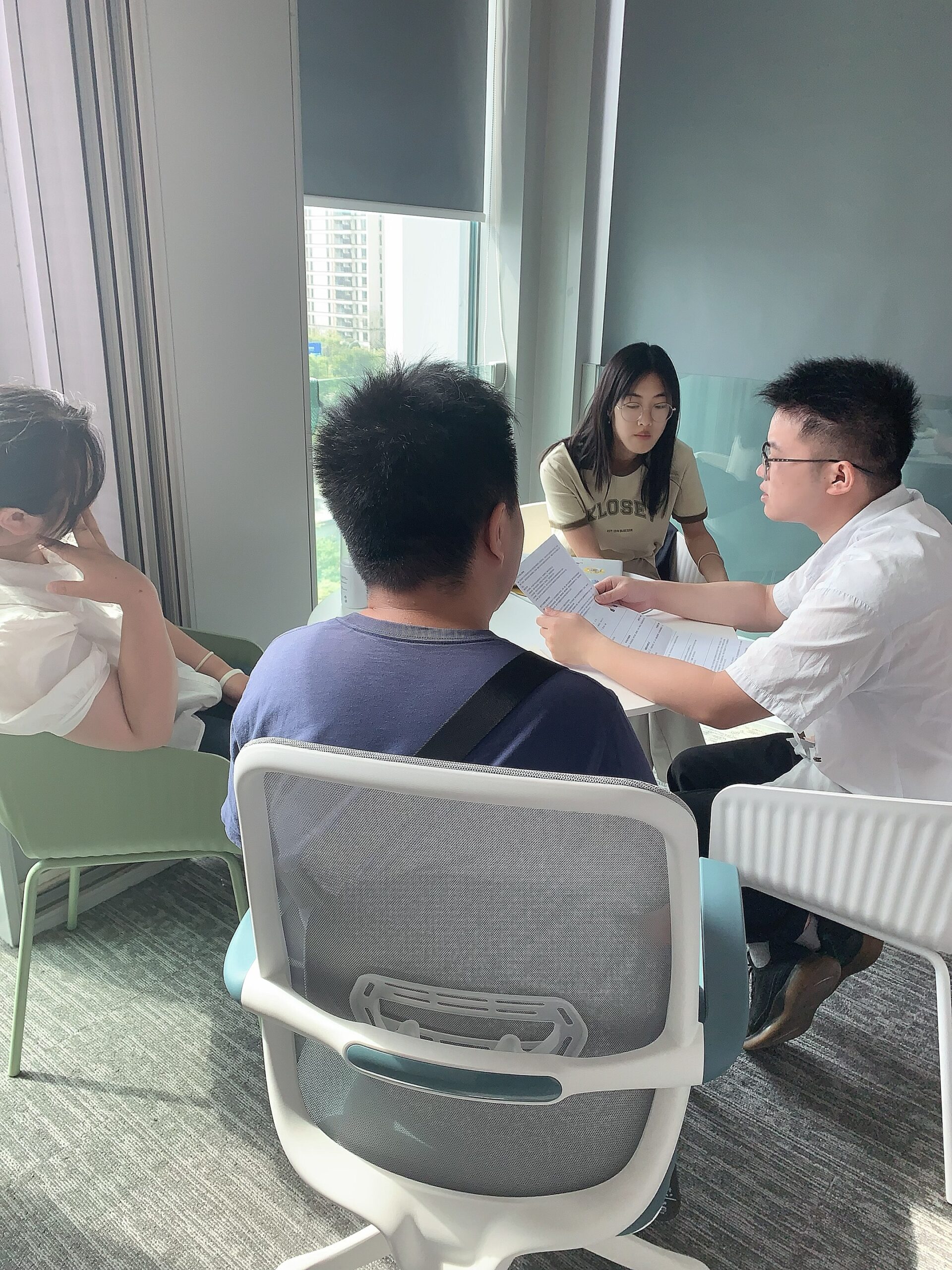 A technical director providing one-on-one FPGA guidance to a student.