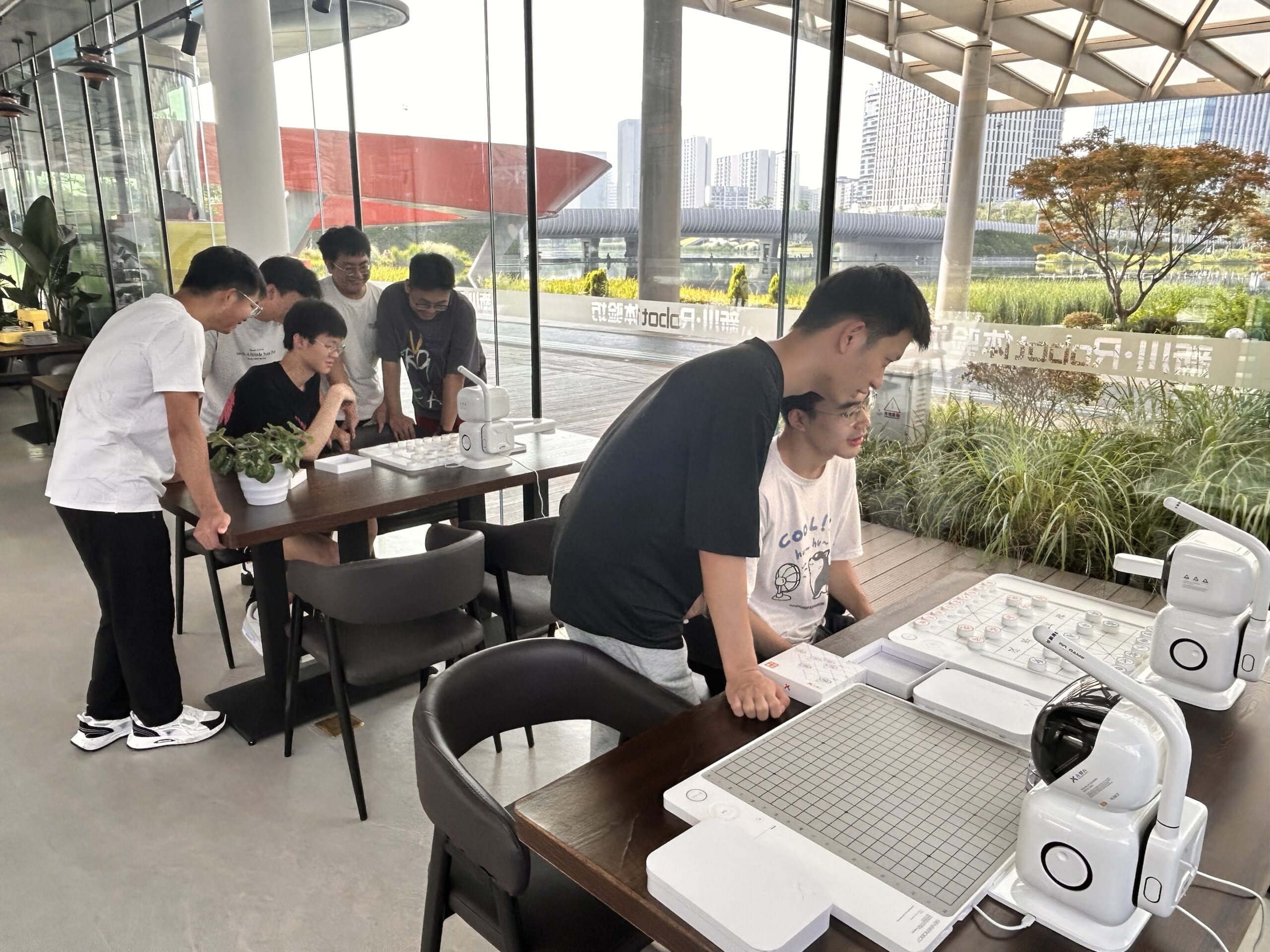 Intelligent cooking robot preparing Kung Pao Chicken