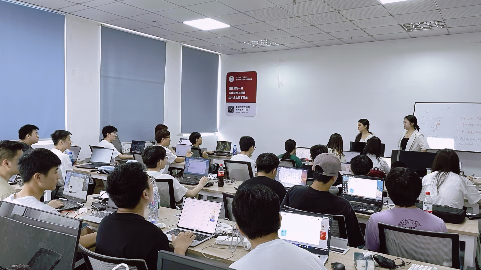 A person studying on a laptop during a commute.